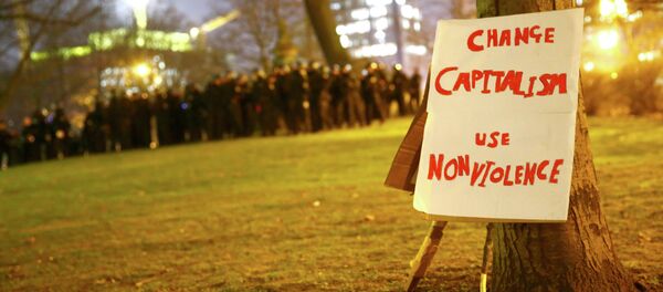 A protest placard is propped against a tree during an anti-capitalist demonstration in Frankfurt March 18, 2015 A protest placard is propped against a tree during an anti-capitalist demonstration in Frankfurt March 18, 2015 - Sputnik International