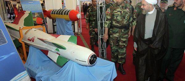 Iran's President Hassan Rouhani, second right, listens to Defense Minister Hossein Dehghan, right, while visiting a defense industry display in Tehran, Iran, Sunday, Aug. 24, 2014 - Sputnik International