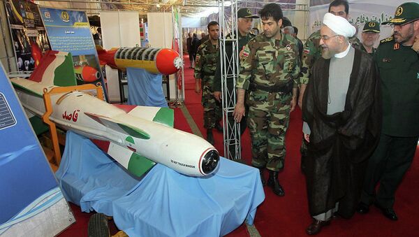Iran's President Hassan Rouhani, second right, listens to Defense Minister Hossein Dehghan, right, while visiting a defense industry display in Tehran, Iran, Sunday, Aug. 24, 2014 - Sputnik International
