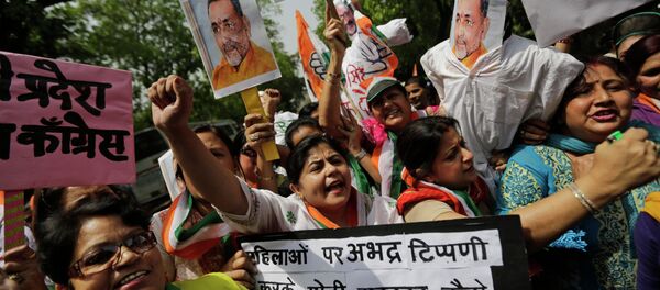 Activists of India’s opposition Congress party’s women’s wing shout slogans against the ruling Bharatiya Janata Party (BJP) during a protest outside the BJP headquarters in New Delhi, India, Thursday, April 2, 2015 Activists of India’s opposition Congress party’s women’s wing shout slogans against the ruling Bharatiya Janata Party (BJP) during a protest outside the BJP headquarters in New Delhi, India, Thursday, April 2, 2015 - Sputnik International