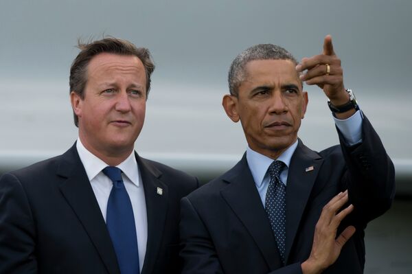 US President Barack Obama, right, stands alongside British Prime Minister David Cameron US President Barack Obama, right, stands alongside British Prime Minister David Cameron - Sputnik International