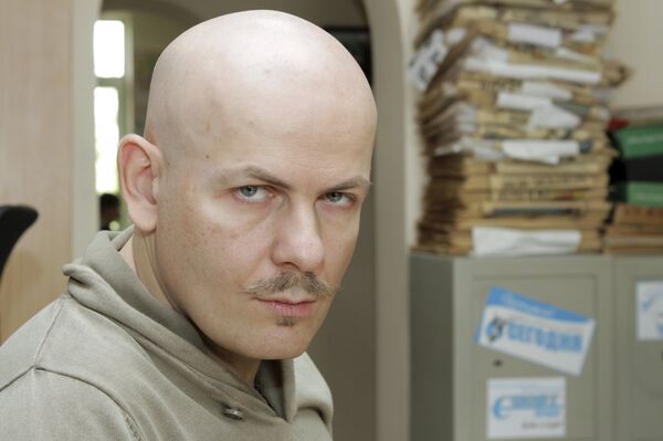 Journalist Oles Buzina looks on at the office of Sevodnya daily newspaper in Kiev in this October 12, 2012 file photo. Journalist Oles Buzina looks on at the office of Sevodnya daily newspaper in Kiev in this October 12, 2012 file photo. - Sputnik International