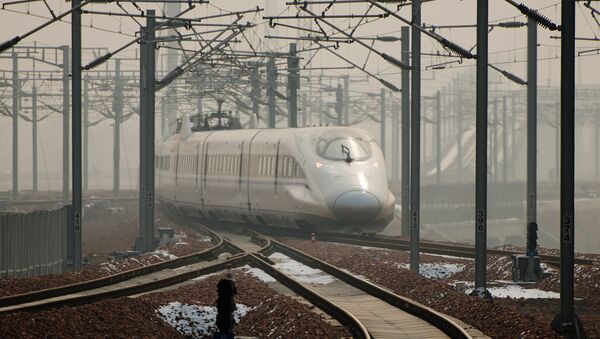 A high-speed train departs a platform in Hebei province south of Beijing on December 22, 2012 - Sputnik International