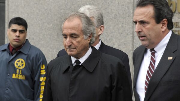 Disgraced Wall Street financier Bernard Madoff leaves US Federal Court after a hearing on March 10, 2009 in New York - Sputnik International