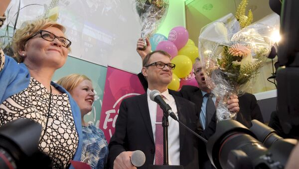 Anu Vehvilainen (L), Annika Saarikko, Chairman Juha Sipila and Juha Rehula of the Centre Party celebrate at the party's parliamentary elections reception in Helsinki after the results of the votes - Sputnik International
