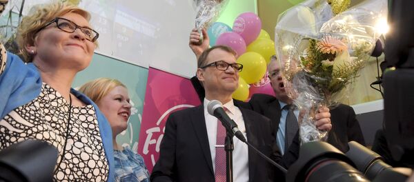 Anu Vehvilainen (L), Annika Saarikko, Chairman Juha Sipila and Juha Rehula of the Centre Party celebrate at the party's parliamentary elections reception in Helsinki after the results of the votes Anu Vehvilainen (L), Annika Saarikko, Chairman Juha Sipila and Juha Rehula of the Centre Party celebrate at the party's parliamentary elections reception in Helsinki after the results of the votes - Sputnik International