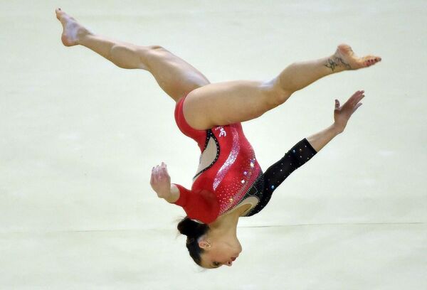 Italy's Vanessa Ferrari competes in a qualifying round of the floor exercise event - Sputnik International