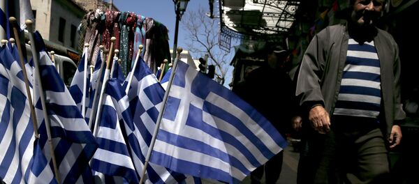 Greek national flags are on display at a shop in central Athens April 17, 2015 Greek national flags are on display at a shop in central Athens April 17, 2015 - Sputnik International