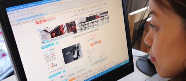 A woman in Beijing shops online at the Taobao website on February 5, 2008 A woman in Beijing shops online at the Taobao website on February 5, 2008 - Sputnik International