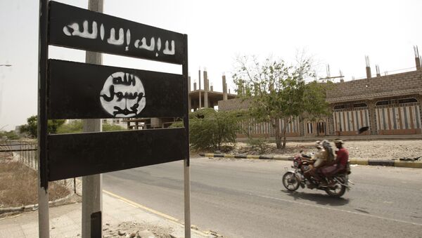 An al-Qaida logo is seen on a street on the town of Jaar in southern Abyan province, Yemen - Sputnik International