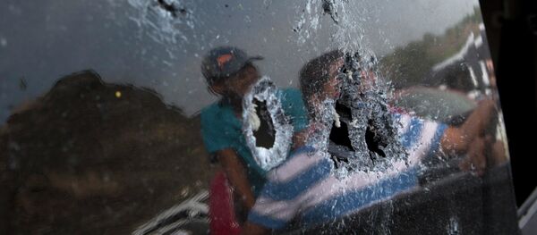 Bullet hole-riddled back windshield of a pickup truck involved in the shooting in Apatzingan, Michoacan state, Mexico. Bullet hole-riddled back windshield of a pickup truck involved in the shooting in Apatzingan, Michoacan state, Mexico. - Sputnik International