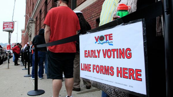 File photo, voters stand in line outside the Hamilton County Board of Elections just before it opened for early voting, in Cincinnati - Sputnik International