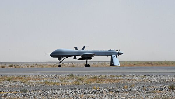 US Predator unmanned drone armed with a missile - Sputnik International