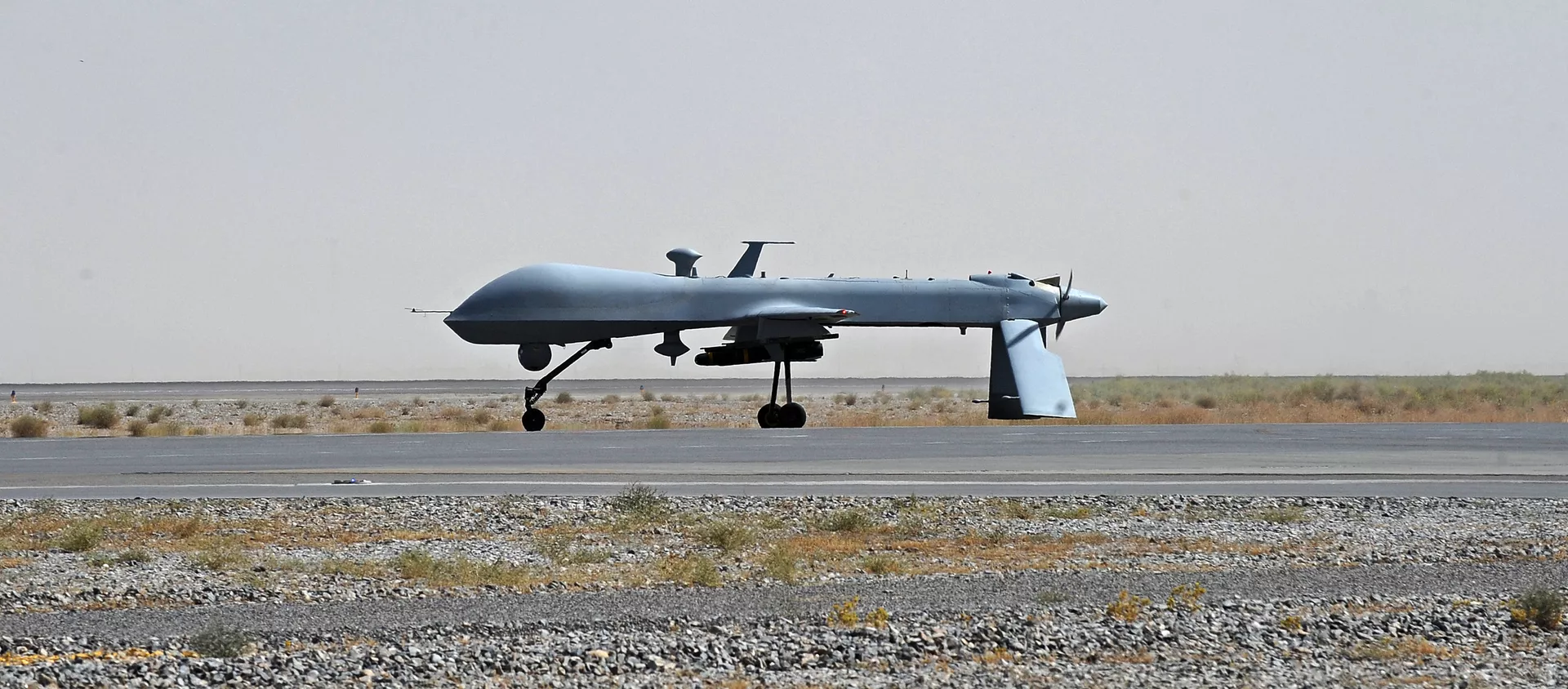  US Predator unmanned drone armed with a missile - Sputnik International, 1920, 27.11.2020