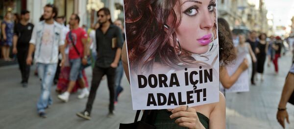 People march with a photograph of Dora Oezer, a transsexual Turkish woman, who according to local media was killed in Kusadasi, to protest violence against members of the gay and transsexual community members, in Istanbul, Turkey, Friday, July 12, 2013. File Photo People march with a photograph of Dora Oezer, a transsexual Turkish woman, who according to local media was killed in Kusadasi, to protest violence against members of the gay and transsexual community members, in Istanbul, Turkey, Friday, July 12, 2013. File Photo - Sputnik International