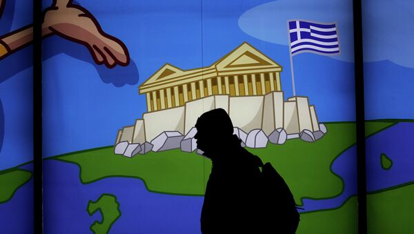 A man walks past a shop with a display window featuring the Acropolis in Athens , on March 14, 2105 - Sputnik International