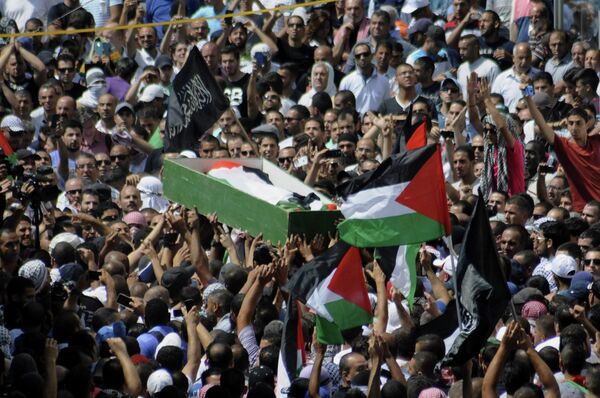 Palestinians carry the body of a 16-year-old Muhammed Abu Khdeir in Jerusalem on Friday, July 4, 2014. Palestinians carry the body of a 16-year-old Muhammed Abu Khdeir in Jerusalem on Friday, July 4, 2014. - Sputnik International