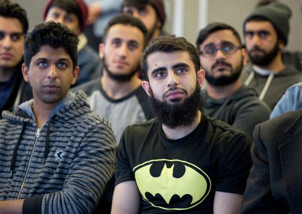 Students at Queens College in New York gather for a vigil, Wednesday, Feb. 18, 2015, in honor of three Muslim students killed recently near the University of North Carolina Students at Queens College in New York gather for a vigil, Wednesday, Feb. 18, 2015, in honor of three Muslim students killed recently near the University of North Carolina - Sputnik International