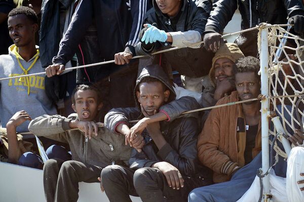 Migrants wait to disembark from the Italian Navy vessel 'Chimera' in the harbor of Salerno, Italy. Migrants wait to disembark from the Italian Navy vessel 'Chimera' in the harbor of Salerno, Italy. - Sputnik International
