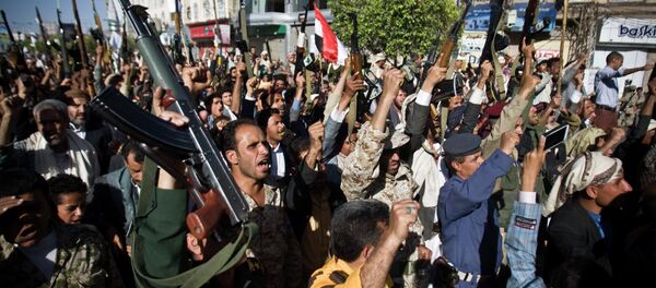 Shiite rebels known as Houthis hold up their weapons as they chant slogans during a protest to denounce the Saudi aggression in Sanaa, Yemen, Wednesday, April 22, 2015 Shiite rebels known as Houthis hold up their weapons as they chant slogans during a protest to denounce the Saudi aggression in Sanaa, Yemen, Wednesday, April 22, 2015 - Sputnik International