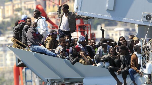 Migrants stand on board of Italian Navy ship Chimera before to be disembarked in the southern harbour of Salerno April 22, 2015 - Sputnik International