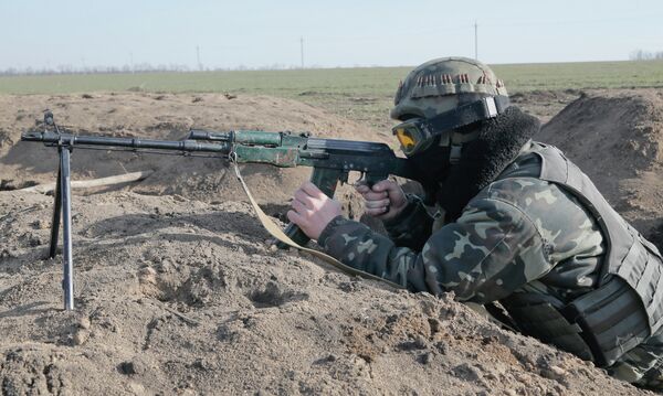 A Ukrainian serviceman takes position at the front line outside Kurahovo, in the Donetsk region of Ukraine A Ukrainian serviceman takes position at the front line outside Kurahovo, in the Donetsk region of Ukraine - Sputnik International