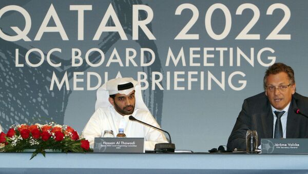 Hassan Al Thawadi, head of the Qatar 2022 World Cup organizing committee, center, and FIFA Secretary General Jerome Valcke give a press conference, in Doha. - Sputnik International