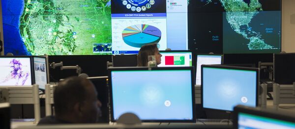 Staff members sit at their work stations at the National Cybersecurity and Communications Integration Center in Arlington, Virginia, January 13, 2015 - Sputnik International