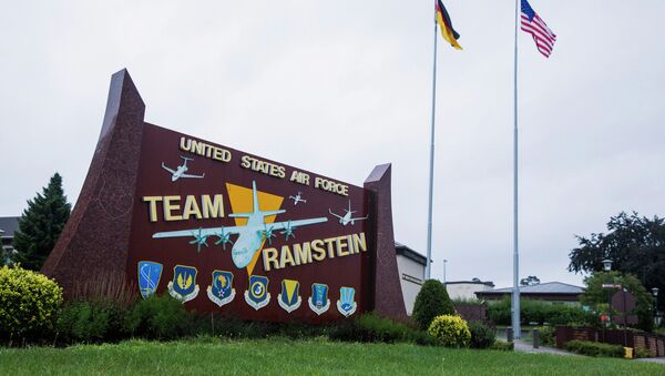 The US and German flags fly behind a sign at Ramstein Air Base, Germany. - Sputnik International