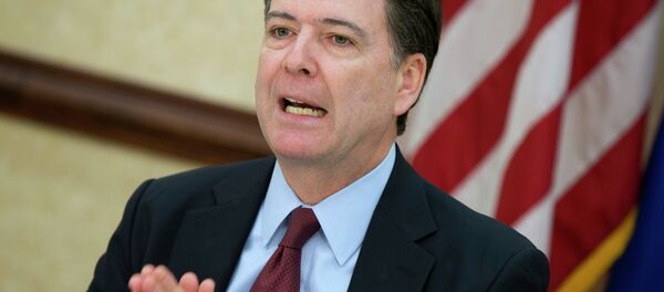 FBI director James Comey gestures during a news conference at FBI headquarters in Washington - Sputnik International