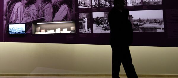 A man stands by archive photographs during an exhibition about the Armenian Genocide at the Armenian Genocide Museum in Yerevan on April 21, 2015 A man stands by archive photographs during an exhibition about the Armenian Genocide at the Armenian Genocide Museum in Yerevan on April 21, 2015 - Sputnik International