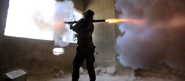 A female Syrian soldier from the Republican Guard commando battalion fires a rocket-propelled grenade (RPG) during clashes with rebels in the restive Jobar area, in eastern Damascus, on March 25, 2015 A female Syrian soldier from the Republican Guard commando battalion fires a rocket-propelled grenade (RPG) during clashes with rebels in the restive Jobar area, in eastern Damascus, on March 25, 2015 - Sputnik International