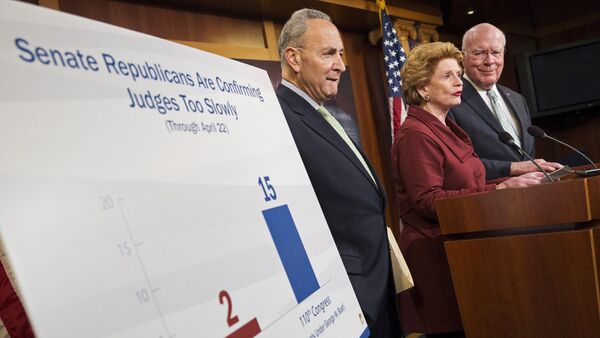 Senators Charles Schumer (L)(D-NY), Debbie Stabenow (D-MI) and Patrick Leahy (D-VT) speak after the cloture vote on the nomination Loretta Lynch to be Attorney General on Capitol Hill in Washington April 23, 2015 - Sputnik International