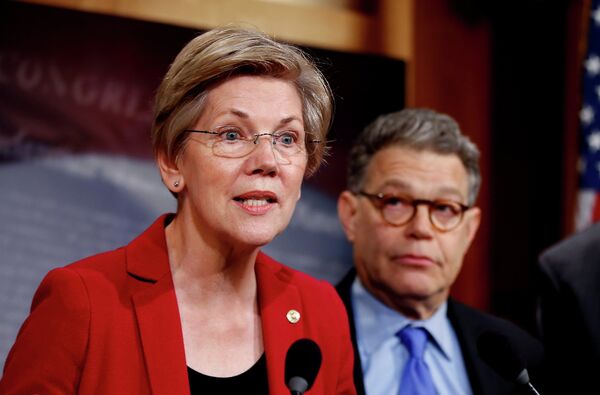 Sen. Elizabeth Warren, D-Mass, left, speaks at a new conference on Capitol Hill in Washington. - Sputnik International