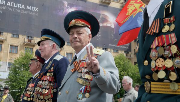 Former Soviet Union army veterans march during a Victory Day celebration, which commemorates the 1945 defeat of Nazi Germany, in the center of Kharkiv, Ukraine, Friday, May 9, 2014 - Sputnik International