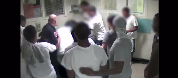 A screenshot of a Rikers CCTV video showing a corrections officer and inmates beating Kalief Browder - Sputnik International