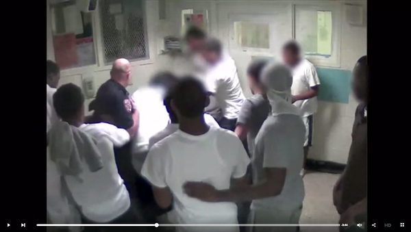 A screenshot of a Rikers CCTV video showing a corrections officer and inmates beating Kalief Browder - Sputnik International