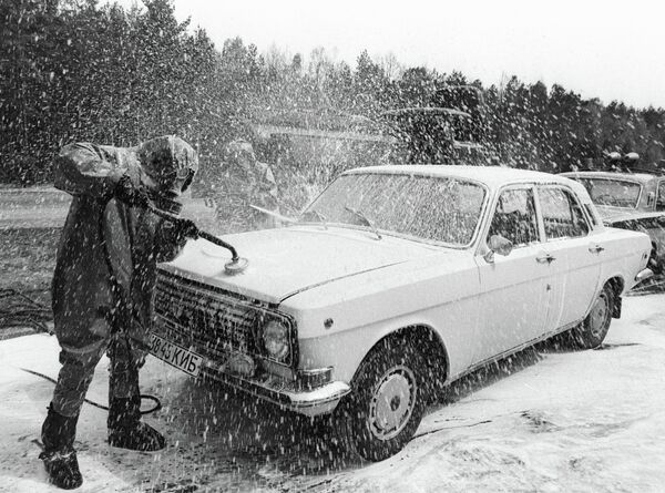 A car leaving the Chernobyl disaster area at the special point of decontamination A car leaving the Chernobyl disaster area at the special point of decontamination - Sputnik International