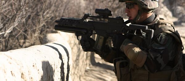 A soldier carries a German gun G36 A soldier carries a German gun G36 - Sputnik International