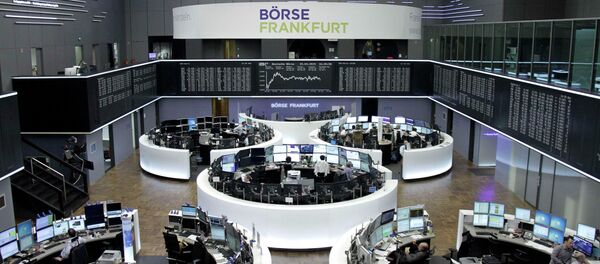Traders are pictured at their desks in front of the DAX board at the Frankfurt stock exchange April 15, 2015 Traders are pictured at their desks in front of the DAX board at the Frankfurt stock exchange April 15, 2015 - Sputnik International