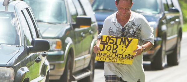 A man tries to collect money for his family on a Miami street corner, two months after losing his job. A man tries to collect money for his family on a Miami street corner, two months after losing his job. - Sputnik International