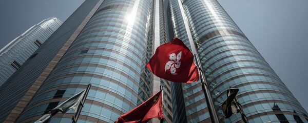 Hong Kong flag (centre-R) fluttering next to the Chinese national flag (centre-L) outside the stock exchange building in Hong Kong Hong Kong flag (centre-R) fluttering next to the Chinese national flag (centre-L) outside the stock exchange building in Hong Kong - Sputnik International