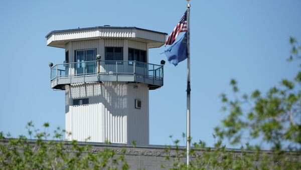 Flags fly near a guard tower at High Desert State Prison Wednesday, April 15, 2015, in Indian Springs, Nev - Sputnik International