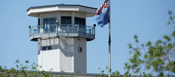 Flags fly near a guard tower at High Desert State Prison Wednesday, April 15, 2015, in Indian Springs, Nev Flags fly near a guard tower at High Desert State Prison Wednesday, April 15, 2015, in Indian Springs, Nev - Sputnik International