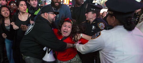 A protester is detained by New York police during a demonstration calling for social, economic and racial justice, in the Manhattan borough of New York City April 29, 2015 A protester is detained by New York police during a demonstration calling for social, economic and racial justice, in the Manhattan borough of New York City April 29, 2015 - Sputnik International