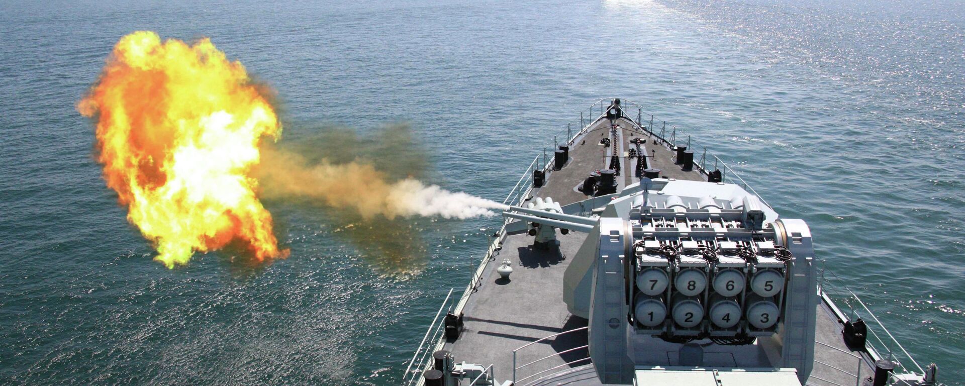 In this April 26, 2012 file photo released by China's Xinhua News Agency, Chinese navy's missile destroyer DDG-112 Harbin fires a shell during the China-Russia joint naval exercise in the Yellow Sea - Sputnik International, 1920, 17.04.2023