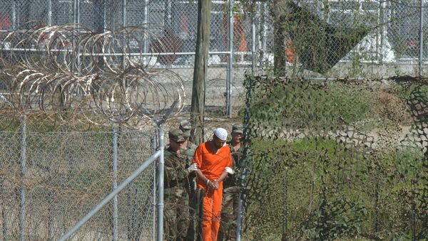 A detainee is escorted to interrogation by U.S. military guards at Camp X-Ray at Guantanamo Bay. - Sputnik International