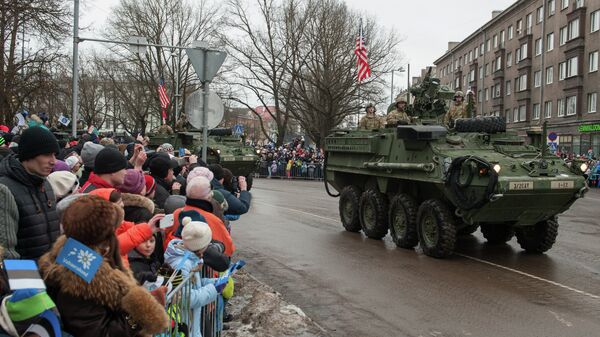 A tank with an US flag takes part in a military parade to celebrate 97 years since first achieving independence in 1918 on February 24, 2015 in Narva, Estonia - Sputnik International