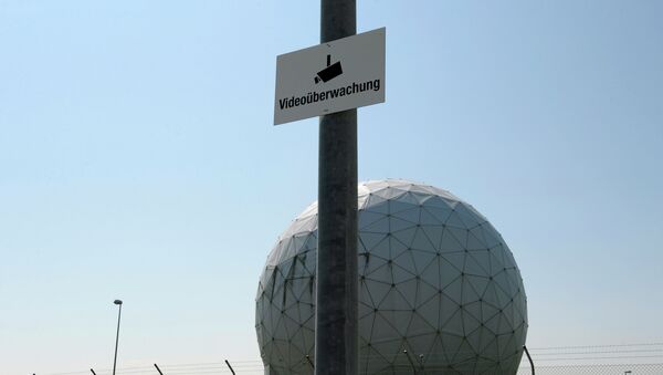 A photo taken on July 16, 2013 shows a sign reading video surveillance fixed to a lamp post in front of radomes of the former monitoring base of the US intelligence organization National Security Agency (NSA) in Bad Aibling, southern Germany - Sputnik International