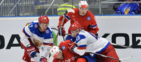 The player of the Russian hockey team Artem Anisimov, Norwegian hockey players Robin Dahlstrom, Andreas Stene, Russian hockey player Evgeny Biryukov during the hockey match, April 2, 2015 - Sputnik International